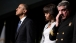 President Barack Obama and First Lady Michelle Obama pause during a memorial service