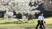 President Obama and Chief of Staff McDonough walk along the South Lawn driveway