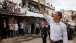 President Obama Waves to the Crowd on the Streets of Cidade de Deus in Rio de Janeiro