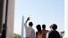 President Barack Obama And First Lady Michelle Obama Wave To The Crowd