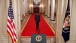 President Obama Walks Through the Cross Hall 