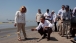 BP Oil Spill President Looking at Tar Ball