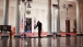 House residence staff sweeps in the Grand Foyer of the White House