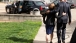 President Barack Obama walks with Oregon Gov. Kate Brown