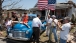 President Barack Obama Greets Hugh Hills In Front Of His Home In Joplin