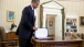 President Barack Obama Pauses After Signing H.R. 3765