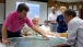 Grand Isle (Louisiana) Mayor David Camardelle points out areas on a map
