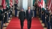 President Barack Obama and Prime Minister Singh of India walk along the Cross Hall 