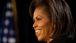 Mrs. Michelle Obama speaks, smiling 