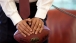 President Barack Obama Leans on a Football