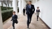 President Obama Runs Along the Colonnade