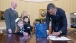 President Obama Signs Memorabilia In The Oval Office