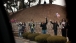 People Wave Along President Barack Obama's Motorcade Route