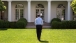 President Obama Returns To The Oval Office From The Rose Garden