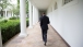 President Barack Obama walks on the Colonnade