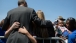 President Barack Obama hugs people at the National Peace Officers Memorial Service