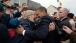 President Barack Obama And First Lady Michelle Obama Greet People Along Main Street