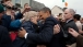 President Barack Obama And First Lady Michelle Obama Greet People Along Main Street