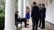 President Barack Obama Talks With Staff Along The Colonnade