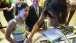 The First Lady signs autographs after the Children's Forum