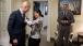 National Security Advisor Rice Helps Vice President Biden