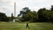 President Barack Obama Walks Across The South Lawn