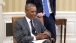  President Obama Looks at Photos with Press Secretary Josh Earnest