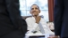 President Obama talks with advisors