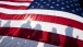 Shadows Fall on a Flag as President Barack Obama Delivers Remarks 