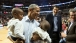 President Obama holds youngsters for a photo at the Bulls-Cavs game