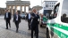 President Obama walks by the Brandenburg Gate in Berlin