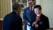 The President gives Nick Wetzel a personal Presidential coin