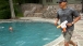 President Obama having a water gun fight with his daughter Sasha on her birthday weekend at Camp David
