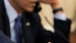 President Barack Obama plays with a Petoskey stone 