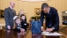 President Barack Obama signs memorabilia for March of Dimes 2013 National Ambassador Nina Centofanti