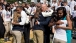 President Barack Obama, First Lady Michelle Obama and Vice President Joe Biden greet athletes