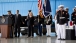 President Barack Obama stands with Secretary of State Hillary Rodham Clinton during the transfer of remains ceremony