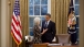 President Obama talks with Secretary Sebelius