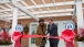 First Lady Michelle Obama And Ken Fisher Attend A Ribbon Cutting Ceremony