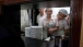Cooks look through window as Vice President Joe Biden eats lunch, Beijing