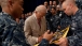 Vice President Joe Biden Signs a Flag for a Group of Sailors at Yokota AFB