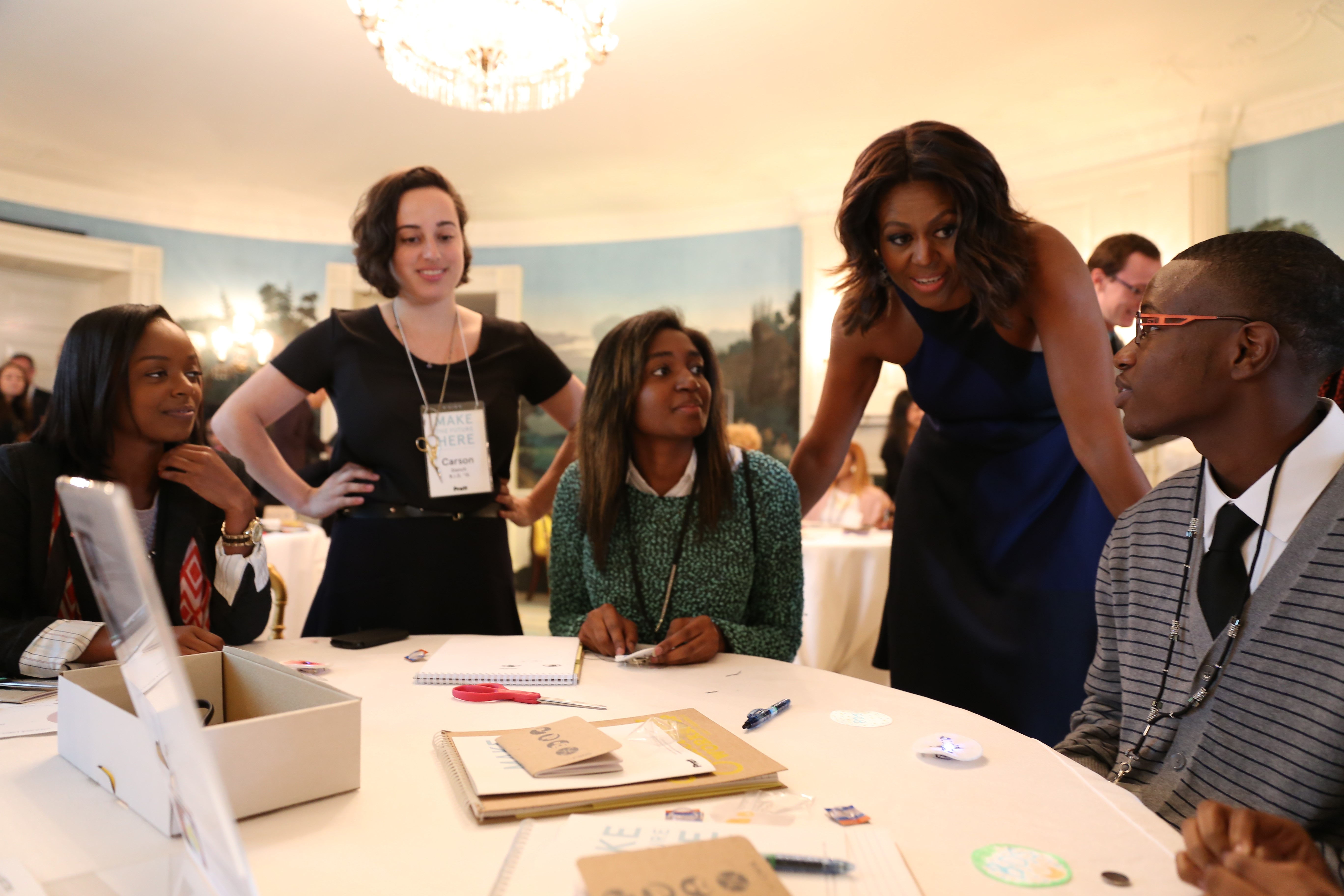 First Lady Michelle Obama checks in with some of the workshop participants.