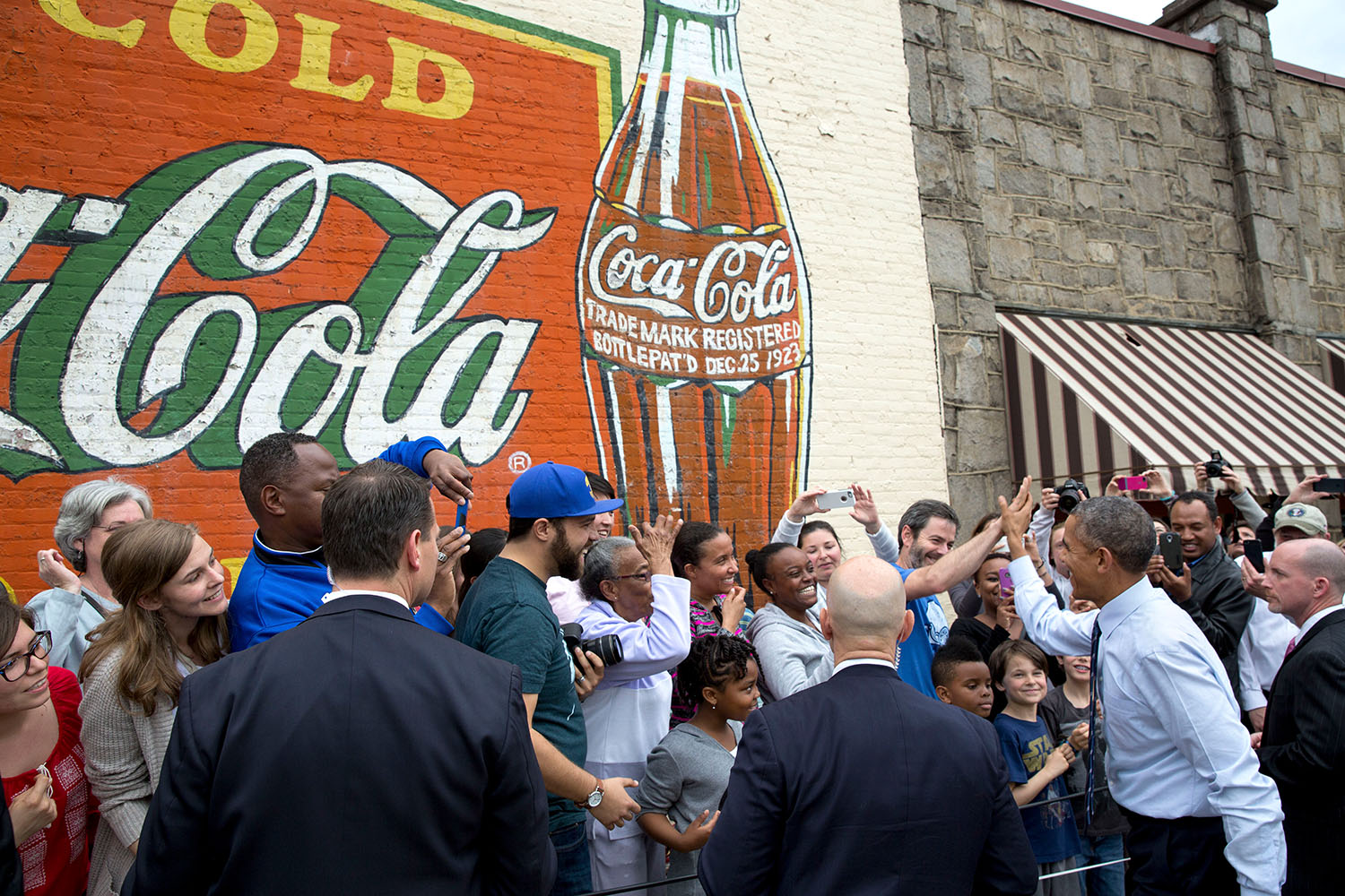 President Barack Obama greets a crowd gathered outside Manuel's Tavern in Atlanta, Ga., March 10, 2015.. (Photo Credit: White House/Pete Souza)