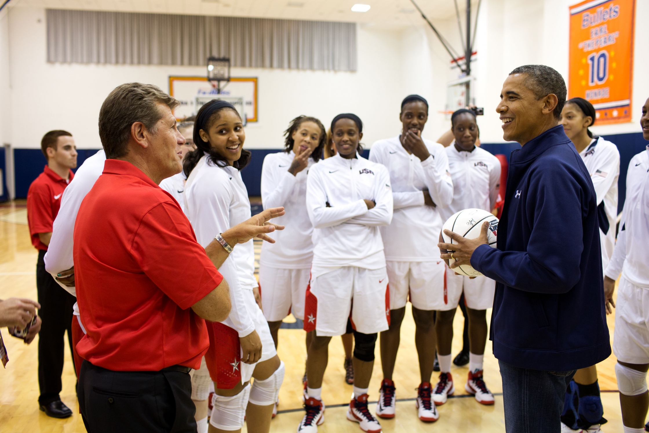President Barack Obama talks with coach Geno Auriemma