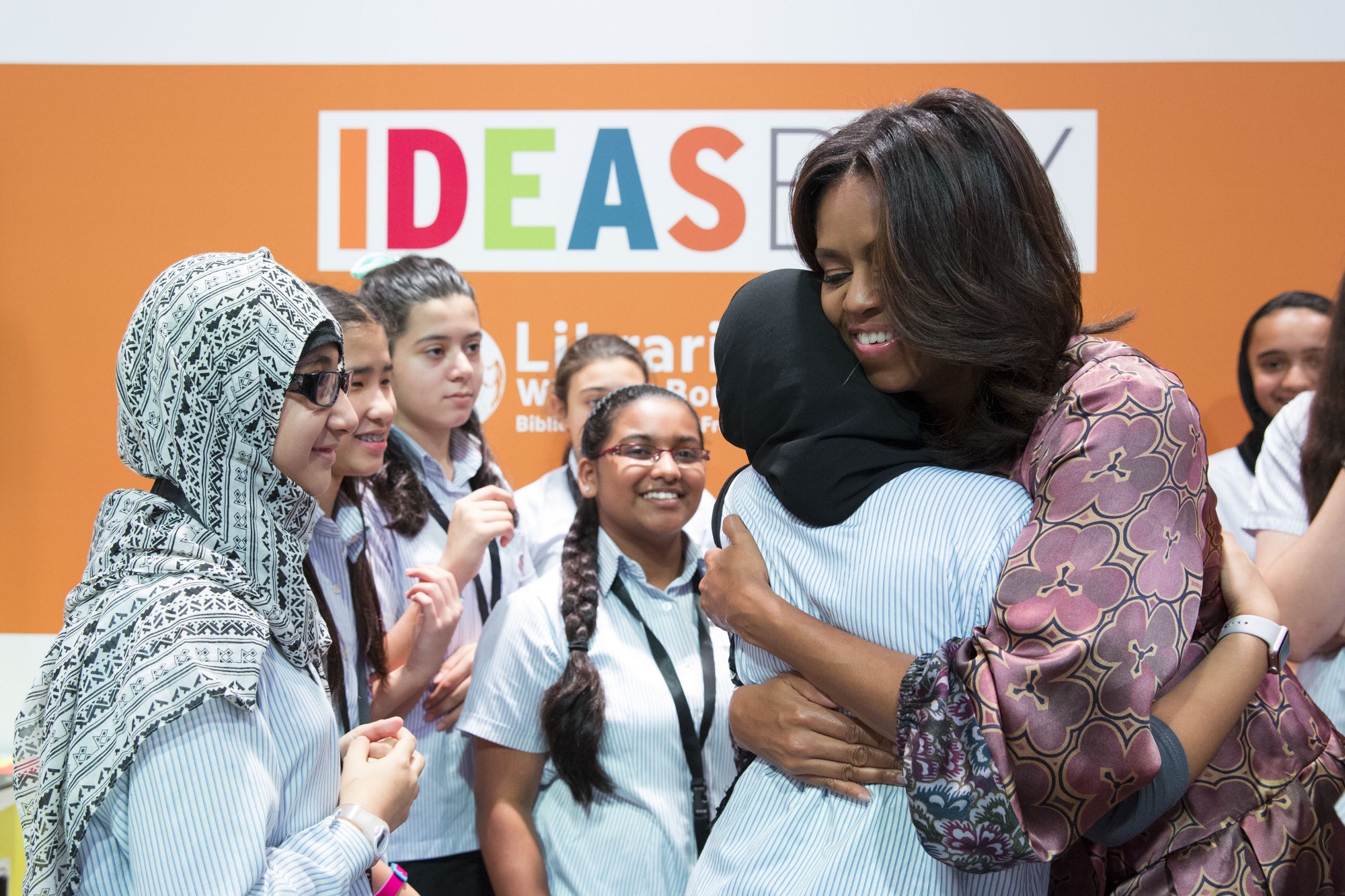  First Lady Michelle Obama hugs a student during a tour of the WISE Summit Learning Labs during the 2015 World Innovation Summit for Education at the Qatar National Convention Centre in Doha, Qatar, Nov. 4, 2015. (Official White House Photo by Amanda Lucidon)