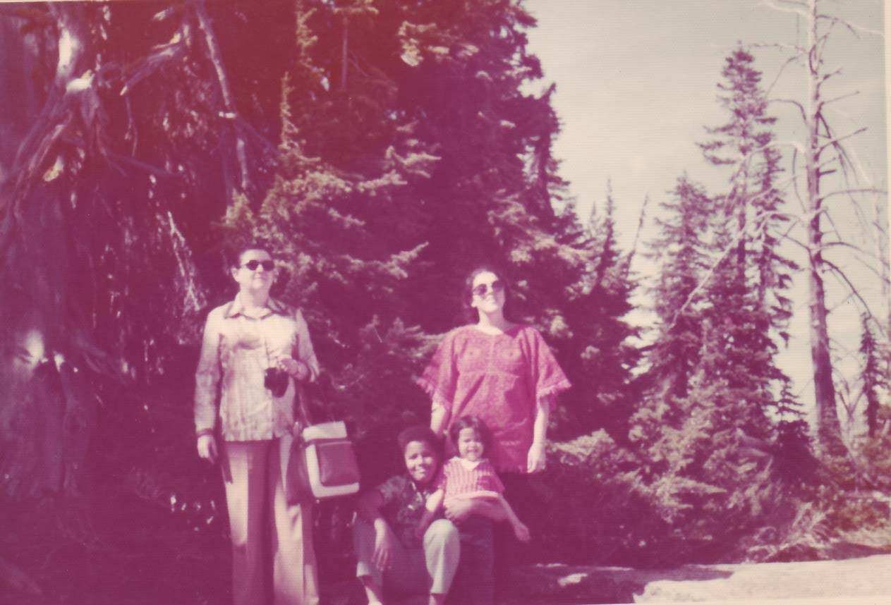 A young Barack Obama with his mother and grandmother at a national park.