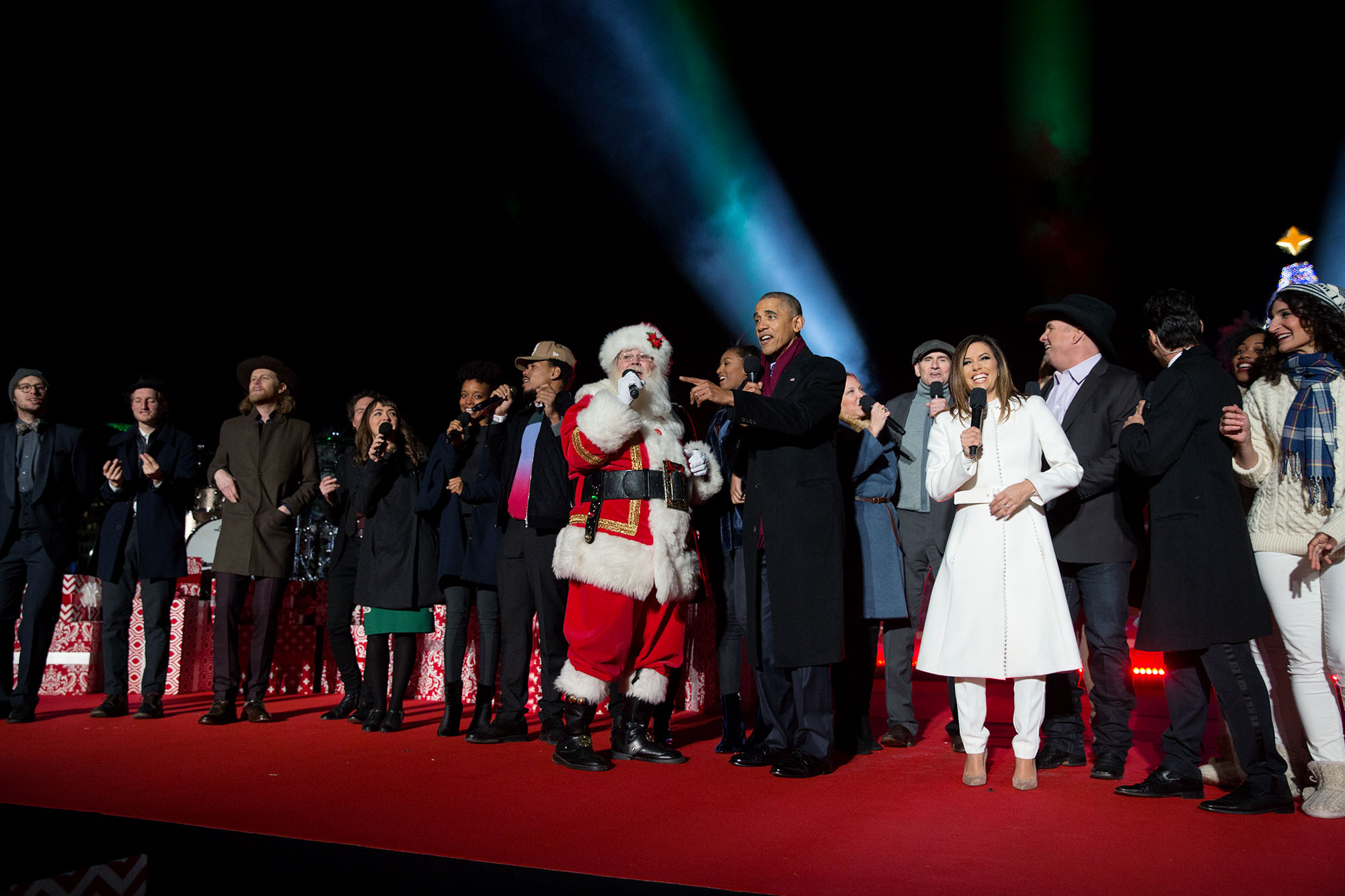 President Barack Obama, First Lady Michelle Obama and daughter Sasha join performers on stage to sing "Jingle Bells" during the National Christmas Tree lighting event on the Ellipse in Washington, D.C., Dec. 1, 2016. (Official White House Photo by Pete Souza)