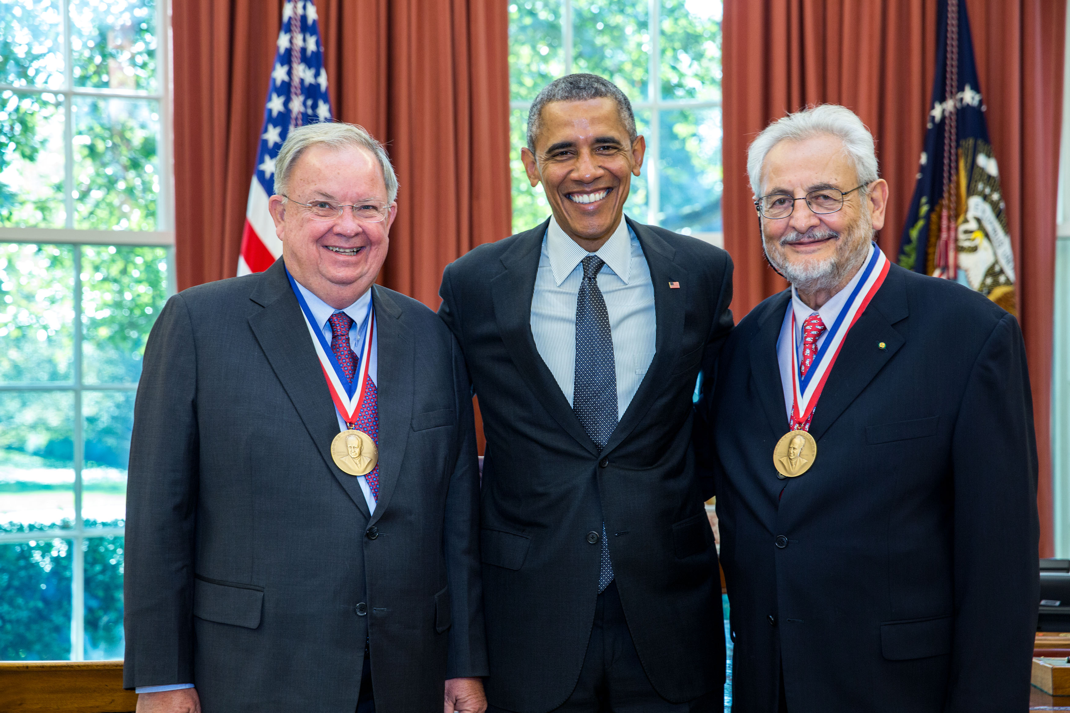 President Barack Obama greets 2014 Enrico Fermi Award recipients Charles Shank, left, and Claudio Pellegrini in the Oval Office, Oct. 20, 2015. (Official White House Photo by Pete Souza)
