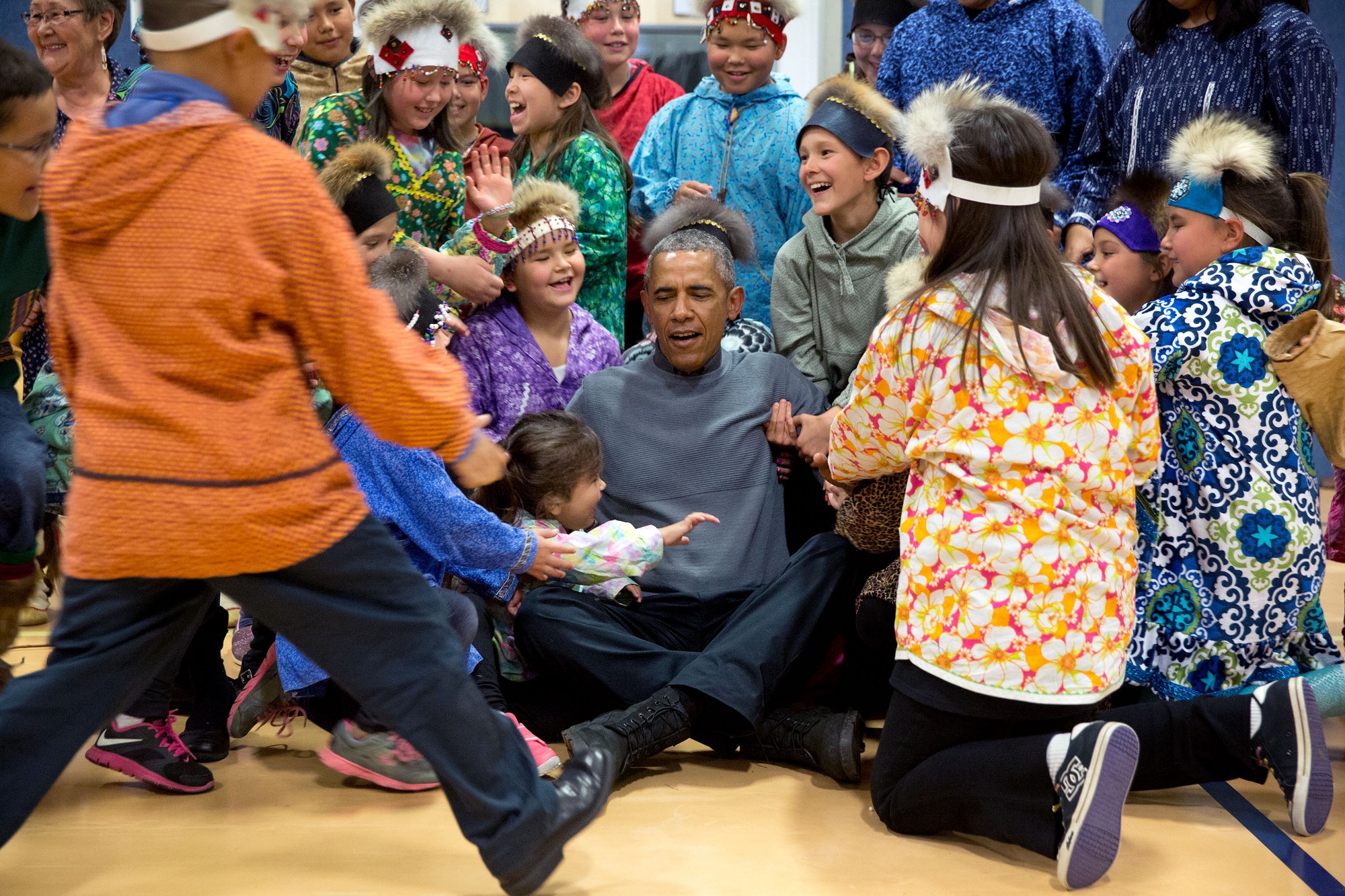 Getting help to his feet after a group photo with the performers. (Official White House Photo by Pete Souza)
