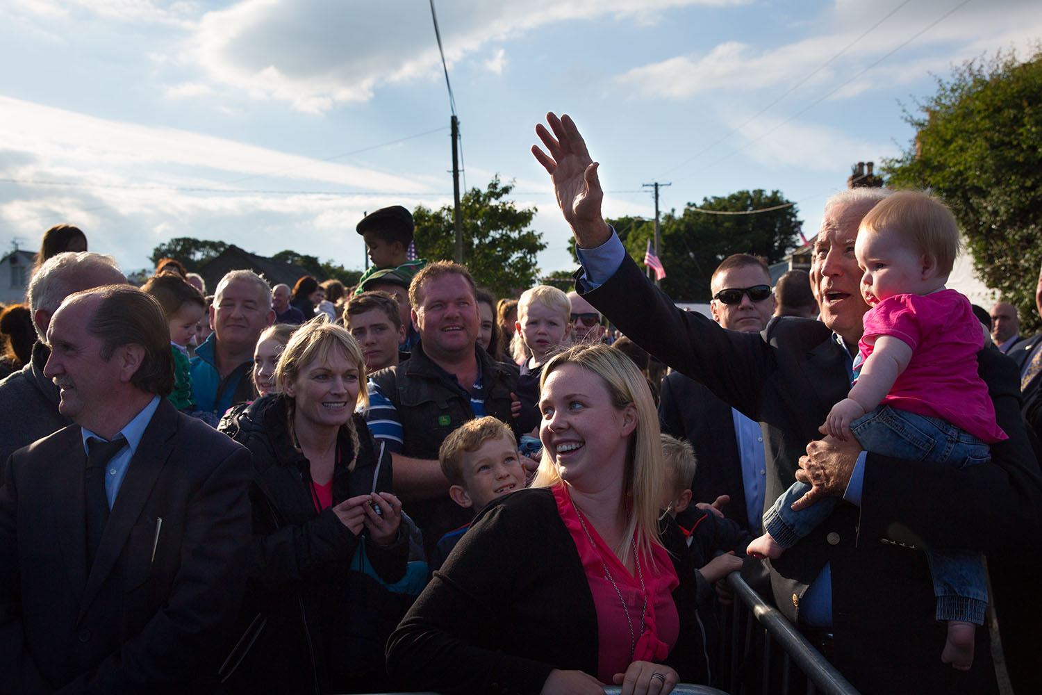 Vice President Joe Biden holds a baby while waving to a family outside Lily Finnegan's Pub which was formerly owned by distant relatives of the Vice president, in County Louth, Ireland, June 25, 2016. (Official White House Photo by David Lienemann)